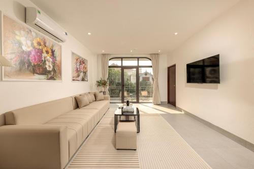 a living room with a couch and a table at Zen House Ninh Bình in Ninh Binh