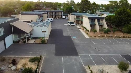 an aerial view of a parking lot next to houses at Bendigo Motor Inn in Bendigo