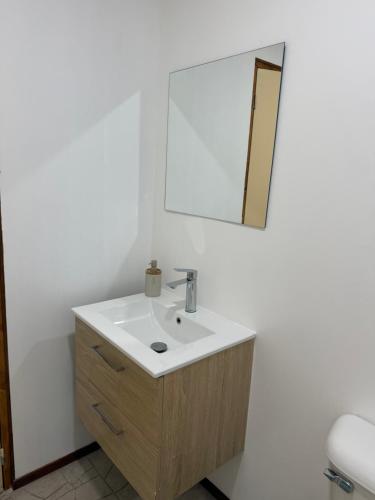 a bathroom with a sink and a mirror at Studio VAI in HUH