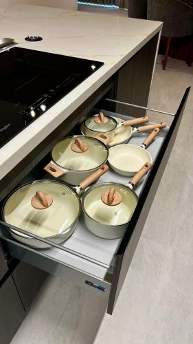 a row of dishes sitting on a shelf in an oven at Sonoran Star Luxury 3 Bedroom Breachfront Condominium in Puerto Peñasco