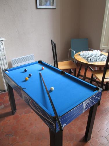 a pool table with balls on it in a room at La Maïoun Guesthouse in Nice