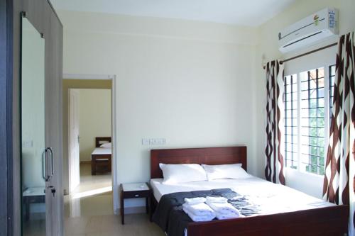 Cama o camas de una habitación en Fortbeach Service Apartments