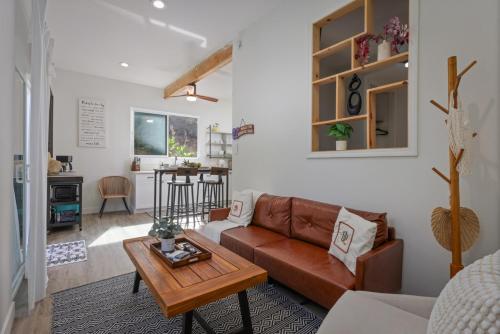 a living room with a couch and a table at Quiet 2BR Kona Retreat Beach Gear BBQ Patio in Kailua-Kona