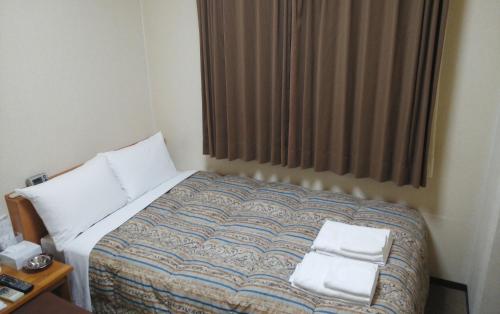 Katil atau katil-katil dalam bilik di Hotel Miyako Hills