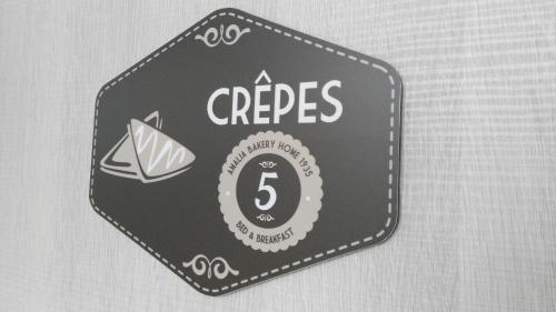 a sign that says crepes with a paper boat at Amalia Bakery Home in Gallarate