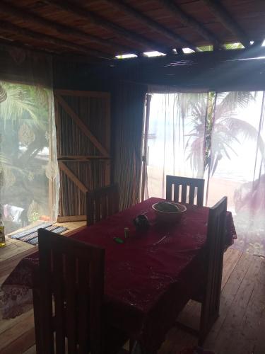 a dining room with a table with a bowl on it at Maison typique Madagascar in Anjiabe