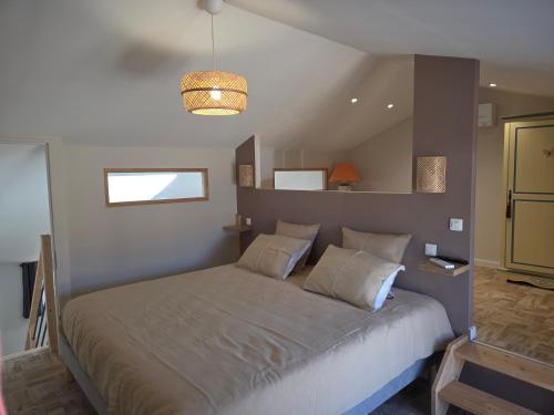 Llit o llits en una habitació de Le pommier