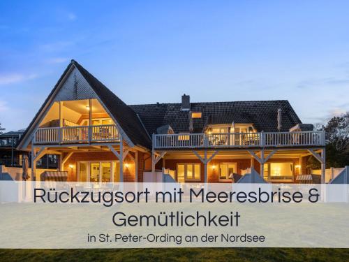 a house is shown with the words ritzlezustnutnut mementos at Entspannter Nordsee-Urlaub in naturnahen Ferienwohnungen im Haus Tide in Böhl