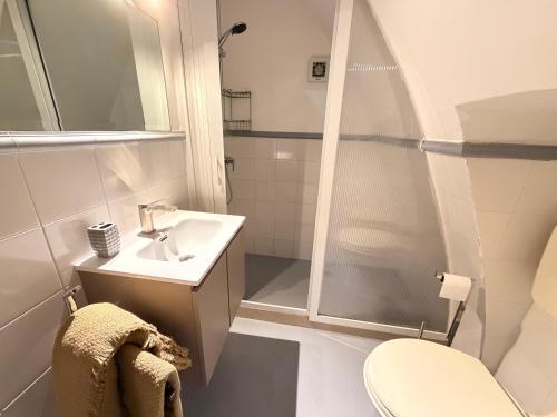 a bathroom with a shower and a sink and a toilet at Suite Del Borgo in Gallipoli