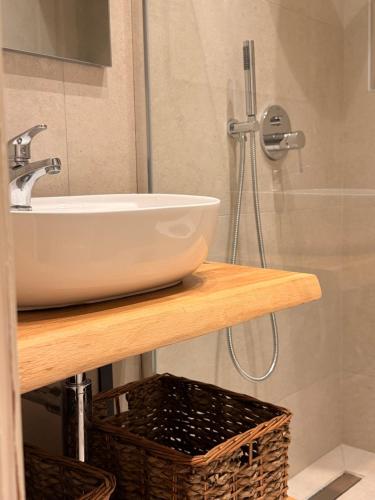 a bathroom with a sink and a shower at Thea Studios in Kassiopi