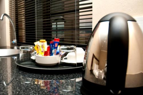 a kitchen counter with a coffee pot on top of it at Eagle Nest Luxury Accommodation in Roodepoort