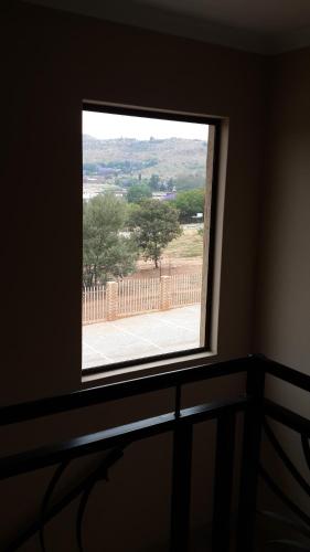 a window in a room with a view at Eagle Nest Luxury Accommodation in Roodepoort