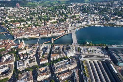 an aerial view of a city and a river at Hotel Central Luzern in Luzern