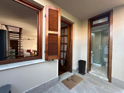 a room with a window and a view of a bathroom at La casa di Carlotta in Loano