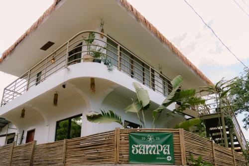 a building with a sign in front of it at SAMPA El Nido in El Nido