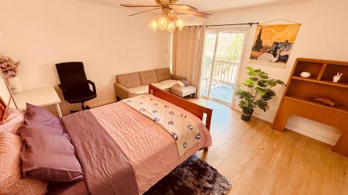a bedroom with a bed and a living room at Joshie home in Rancho Cucamonga