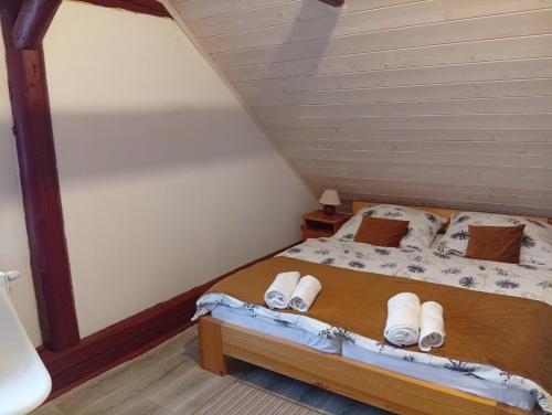 a bedroom with a bed in a attic at Apartmán Eva in Vrbov