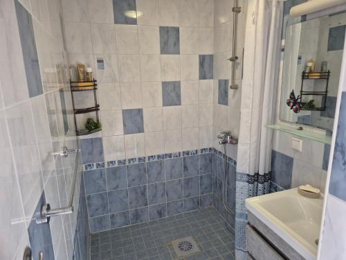 a bathroom with a shower and a sink at Mäe Apartment in Tartu