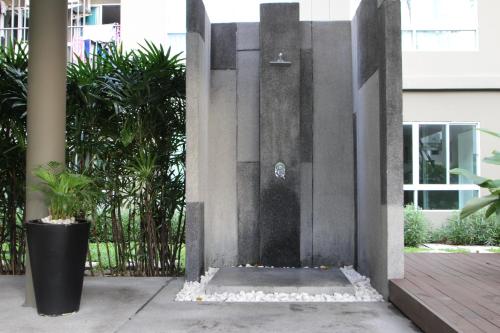 a water fountain in the middle of a building at Dcondo Kathu Patong Phuket by Jack in Kathu