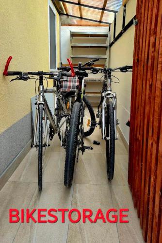 two bikes parked next to each other in a garage at APARTMENt ANAYA in Bovec