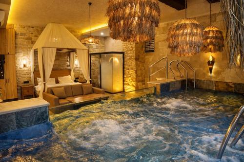 a bathroom with a large tub in a room at Emirtimes Hotel&Spa - Tuzla in Istanbul