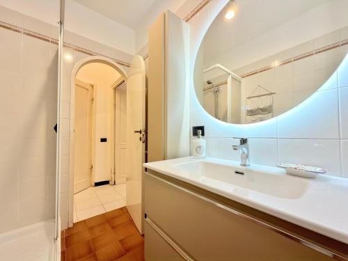 a bathroom with a sink and a mirror at VILLA NORMA in Levanto