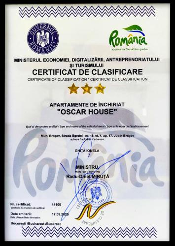 Et logo, certifikat, skilt eller en pris der bliver vist frem på OSCAR HOUSE
