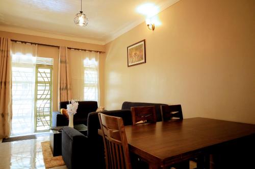 a living room with a table and a couch at Two-bedroom unit in Mubende Town in Mubende