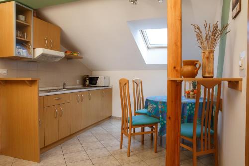 a kitchen with a table and chairs and a window at Apartment Kolman in Tolmin
