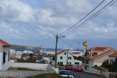 a view of a town with cars parked on a street at Casa de Santa Catarina in Cabo da Praia
