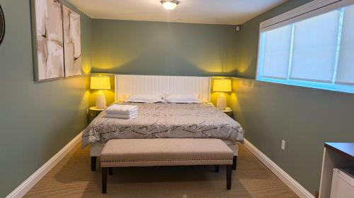a small bedroom with a bed and a window at Private King Bed Room Near UPEI & Downtown Cozy Retreat Near Everything in Charlottetown