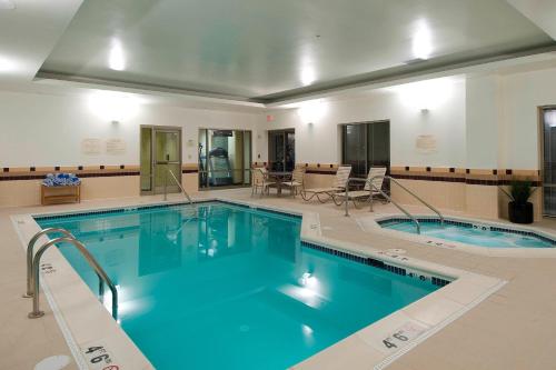 a large swimming pool in a hotel at SpringHill Suites Norfolk Old Dominion University in Norfolk