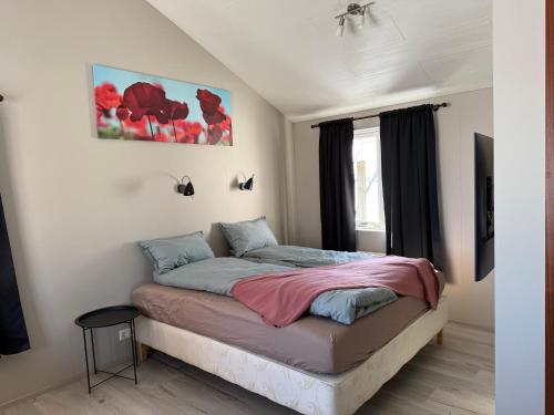 a bedroom with a bed in a room at Árbakki Horsecenter cottage in Hella