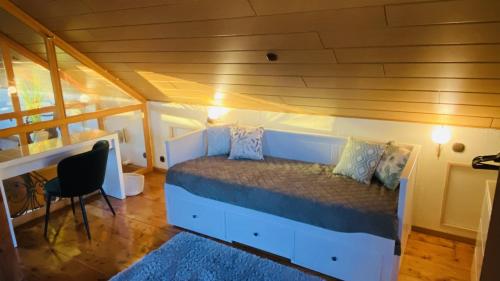 a small bedroom with a bed in a house at Ferienwohnung am Steinweg in Solingen