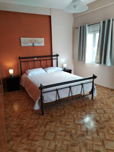 a bedroom with a bed in a room at Takis House in Gavrio