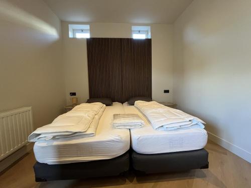 Llit o llits en una habitació de Appartementen het Centrum