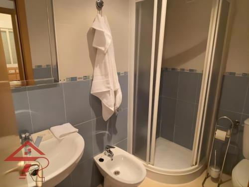 a bathroom with a sink and a toilet and a mirror at Magic World Vistamar lll in El Borseral