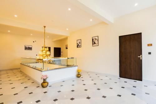 a room with a glass display case on a tiled floor at Virasat-1969 in Udaipur