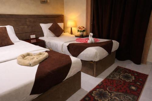 Llit o llits en una habitació de Gardenia Hotel
