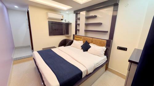 a bedroom with a bed in a small room at Pragati Guest House in Gorakhpur