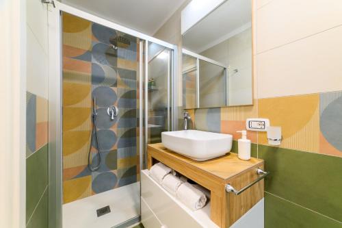 a bathroom with a sink and a shower at Estate4home - Suites Margar in Massa Lubrense