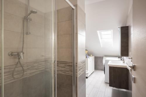 a bathroom with a shower and a sink at Uno Due Tre Stella in Chioggia