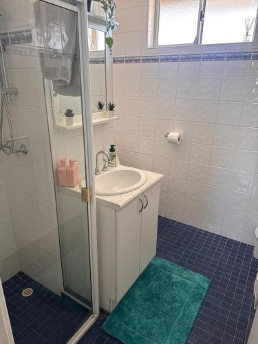 a bathroom with a sink and a shower at Ekaya in Fremantle
