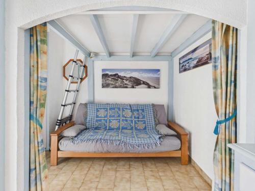 a living room with a couch in a room with a ceiling at Studio cabine mezzanine 6 pers avec parking privé - FR-1-326-403 in Marseillan