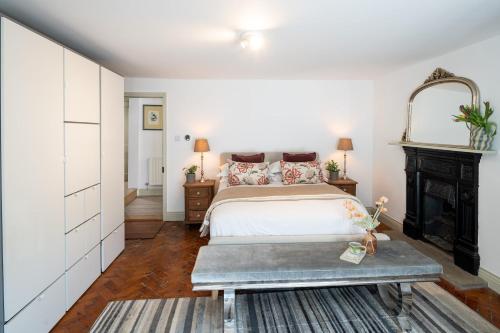 a bedroom with a bed and a fireplace at Modern Flat on the seafront Exmouth in Exmouth