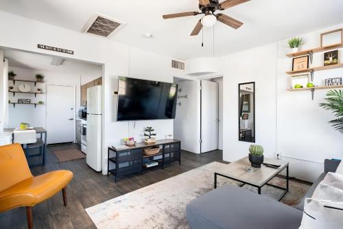 a living room with a couch and a tv at Spring Escape 1BR by UA DT Just 2 Min to Banner in Tucson