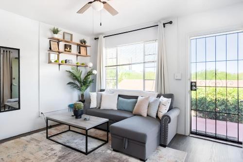 a living room with a couch and a table at Spring Escape 1BR by UA DT Just 2 Min to Banner in Tucson