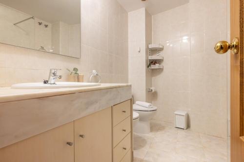 a bathroom with a sink and a toilet at Passeig del Mar in L'Escala