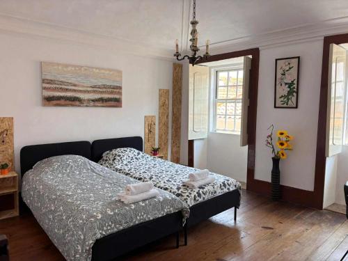 a bedroom with a bed in a room at Esposende Garden in Esposende