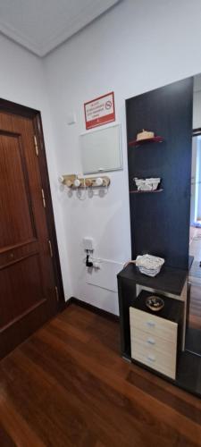 a room with a door and a room with a table at Apartamento Mar in Bádames